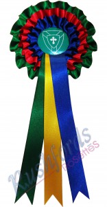-14,5cm Head with 30cm Long Tails-
3 Row/Tier Rosette
​3 tier Ribbons usually consist of 2 to 3 colour ribbons but up to four colours could be used. 
Printing is done on the front ribbon but printing at extra cost could also be done on the all the ribbons. extra tails could also be added.
Personalization of the 3 tier rosette is also an option