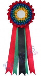 -17,5cm Head with 40c Long Ribbons, centre and back ribbons are 4cm Wide-
4 Tier Rosettes are usually for Best in Category/Division or Champion Rosettes however they can be used for any occasion.
Printing is done on the front ribbon but printing at extra cost could also be done on the all the ribbons. extra tails could also be added.
Personalization of the 4 tier rosette is an option.